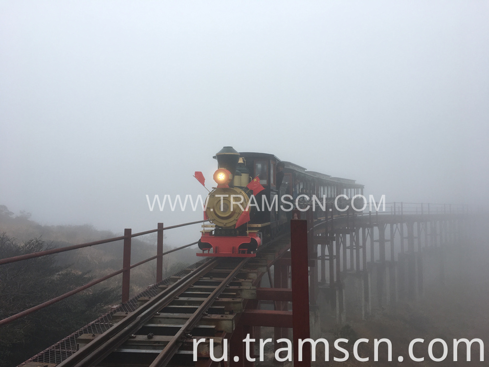 sightseeing train on mountain bridge